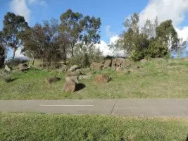 Merri Trail passes rocks and native shrubs at Lakeside College site
